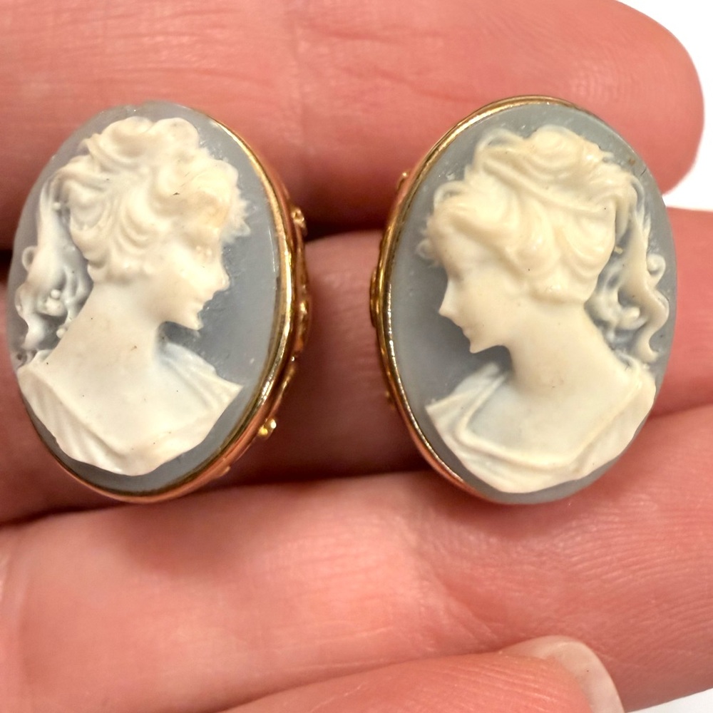 Elegant Gold and Cream Cameo Earrings on light blue background